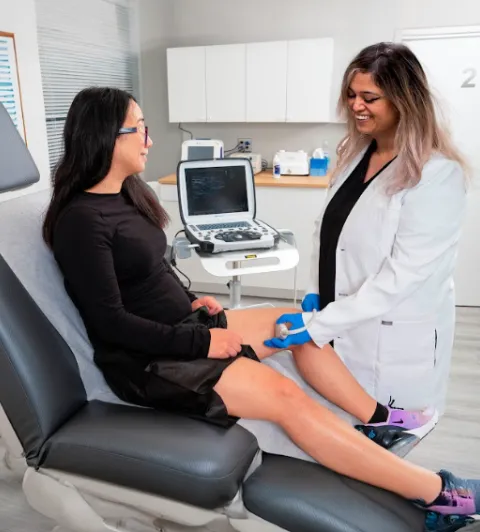 Dr. Shair, board-certified doctor performing an ultrasound review to a patient